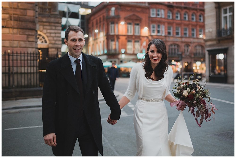 The bride and groom walk from their ceremony at Liverpool Town Hall to Oh Me Oh My for their reception. 