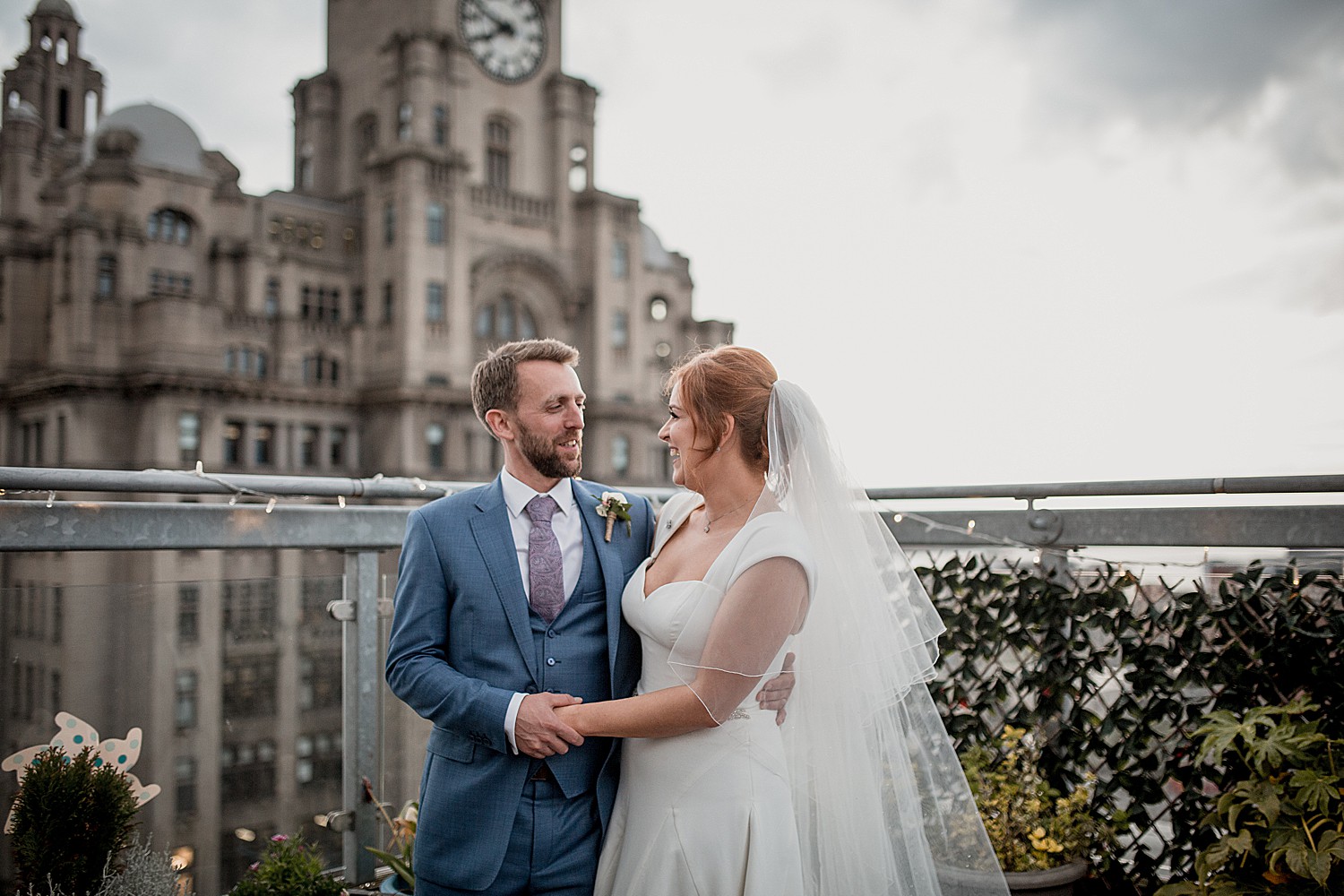 Bride and groom in front of Liver building