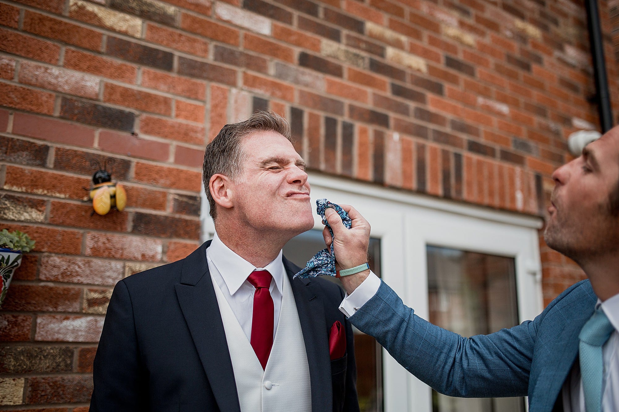 groom getting face wiped
