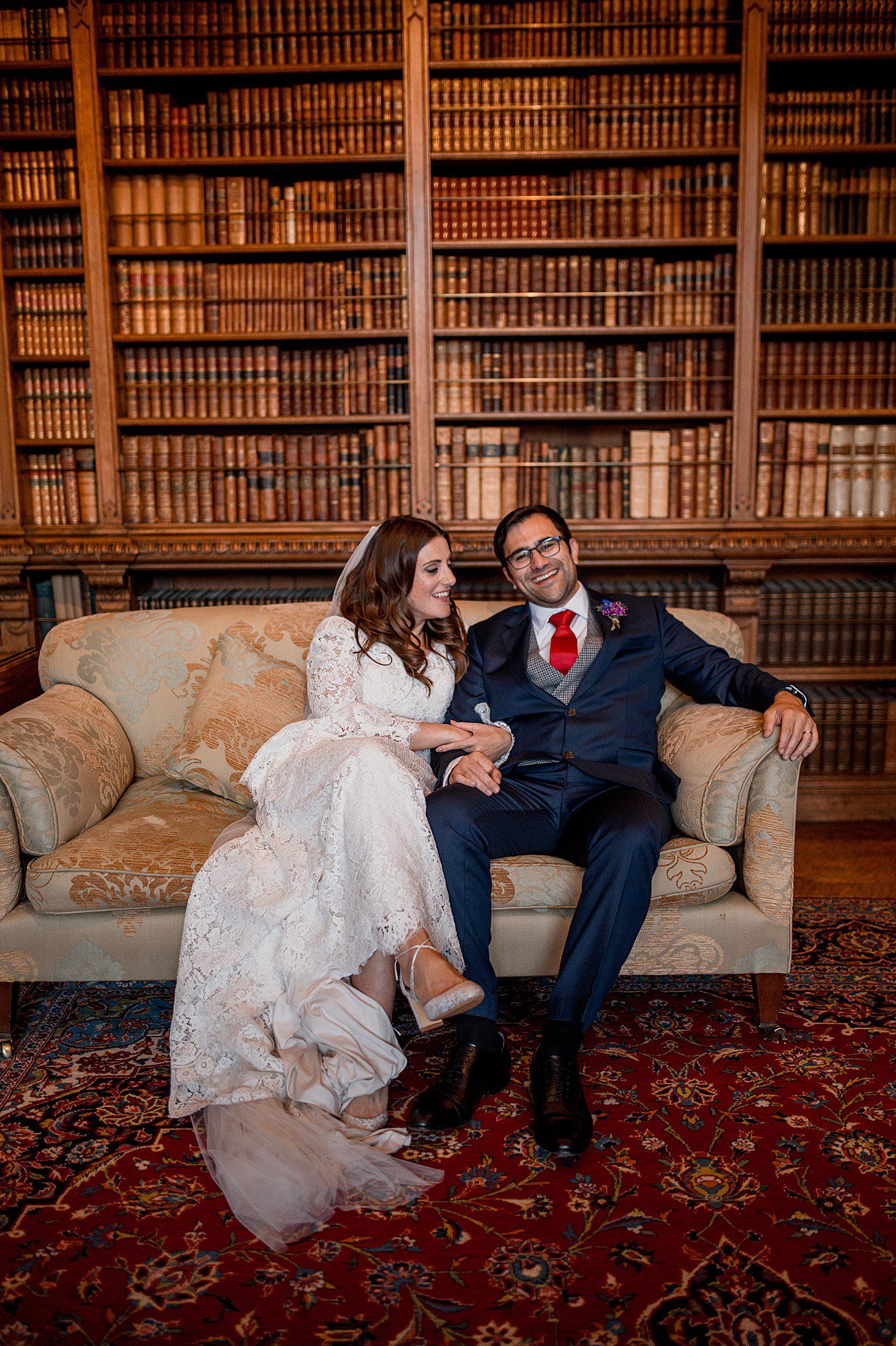 wedding couple in the library at arley hall