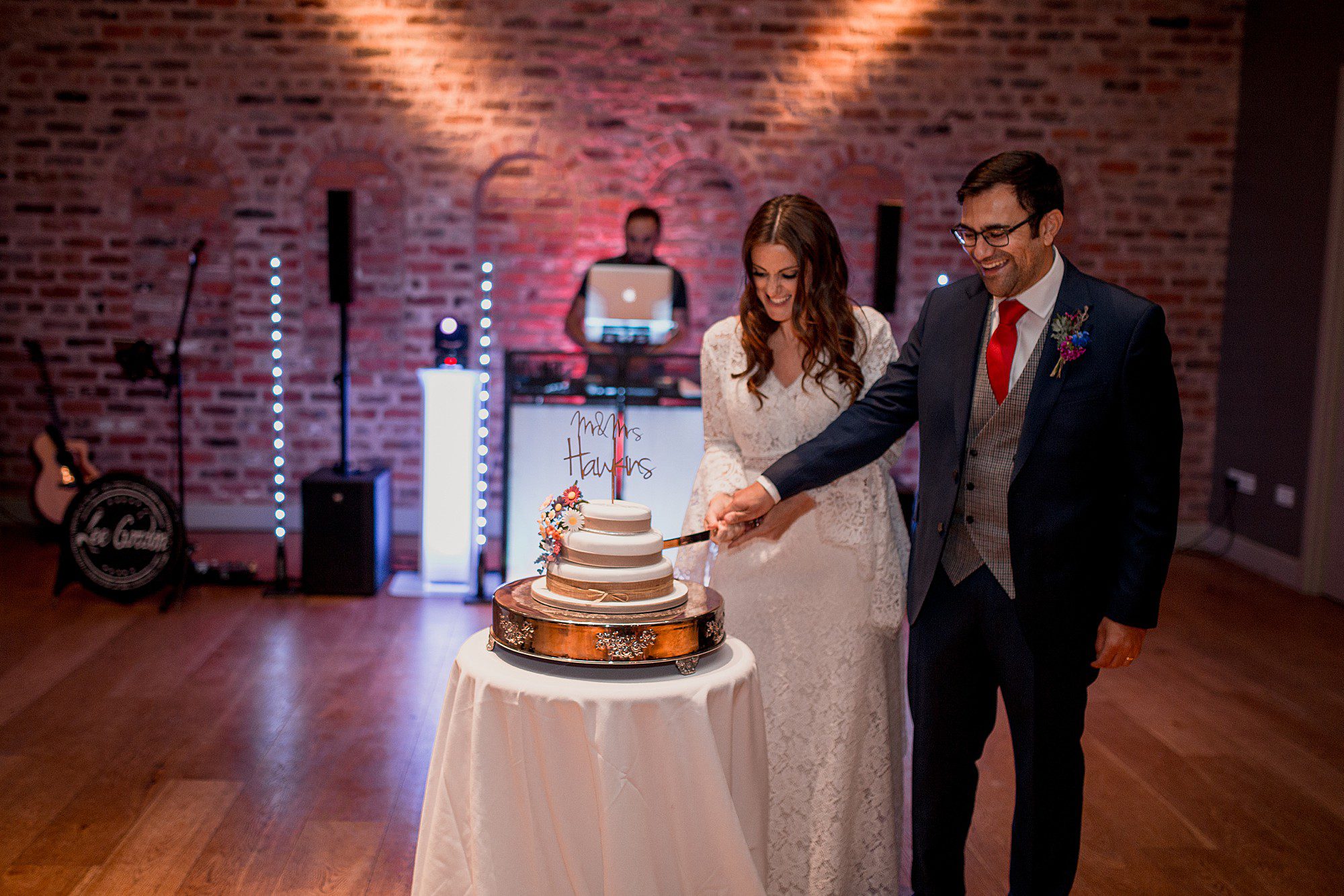 cutting the cake at arley hall