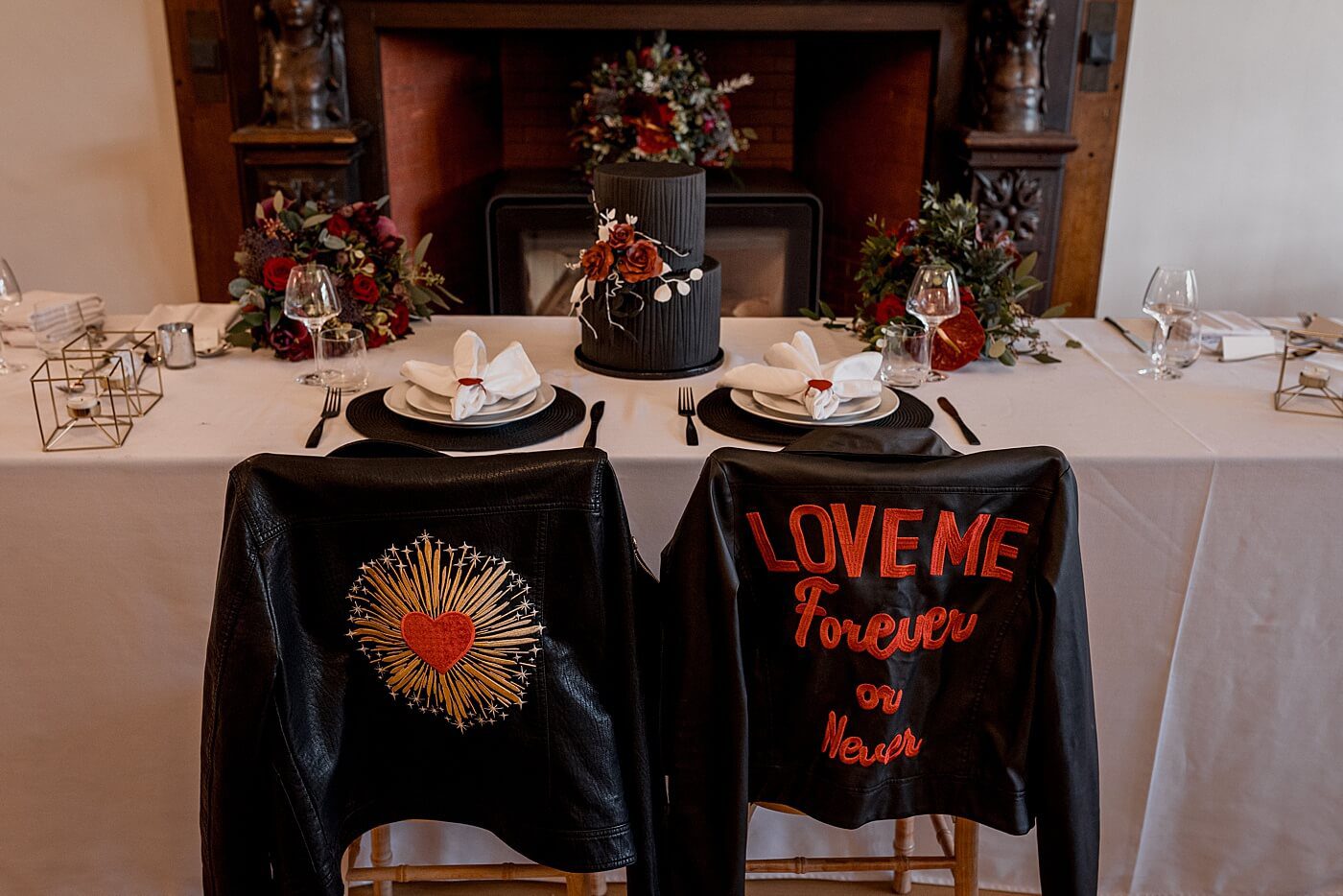 styled shoot with leather jackets and a black cake