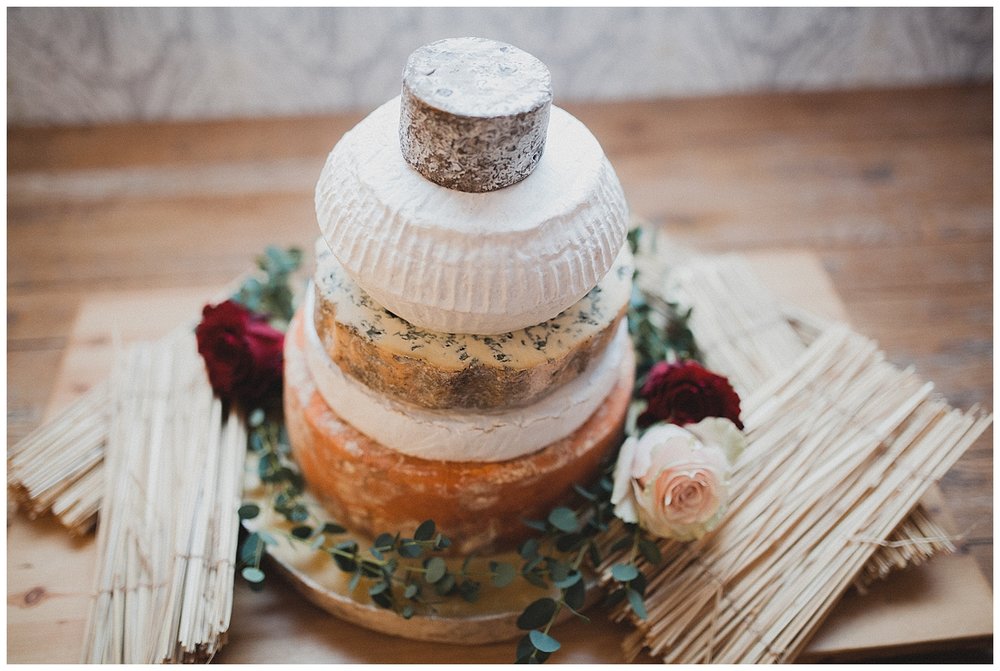  Alternative wedding cake with a differnt round of cheese for each tier. 