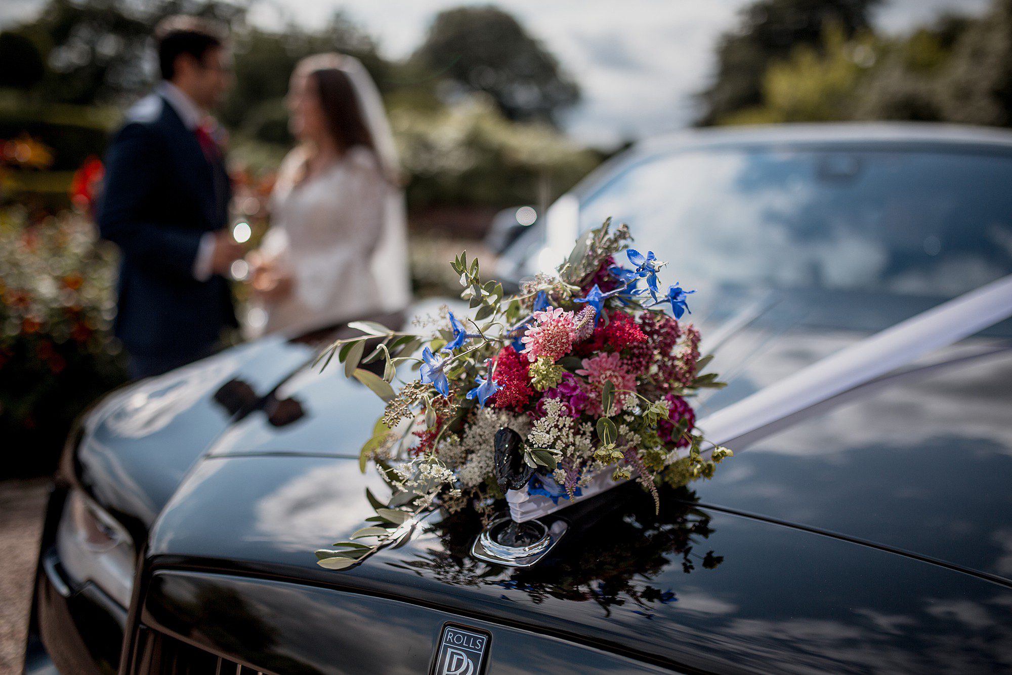 summer wedding flowers on wedding car
