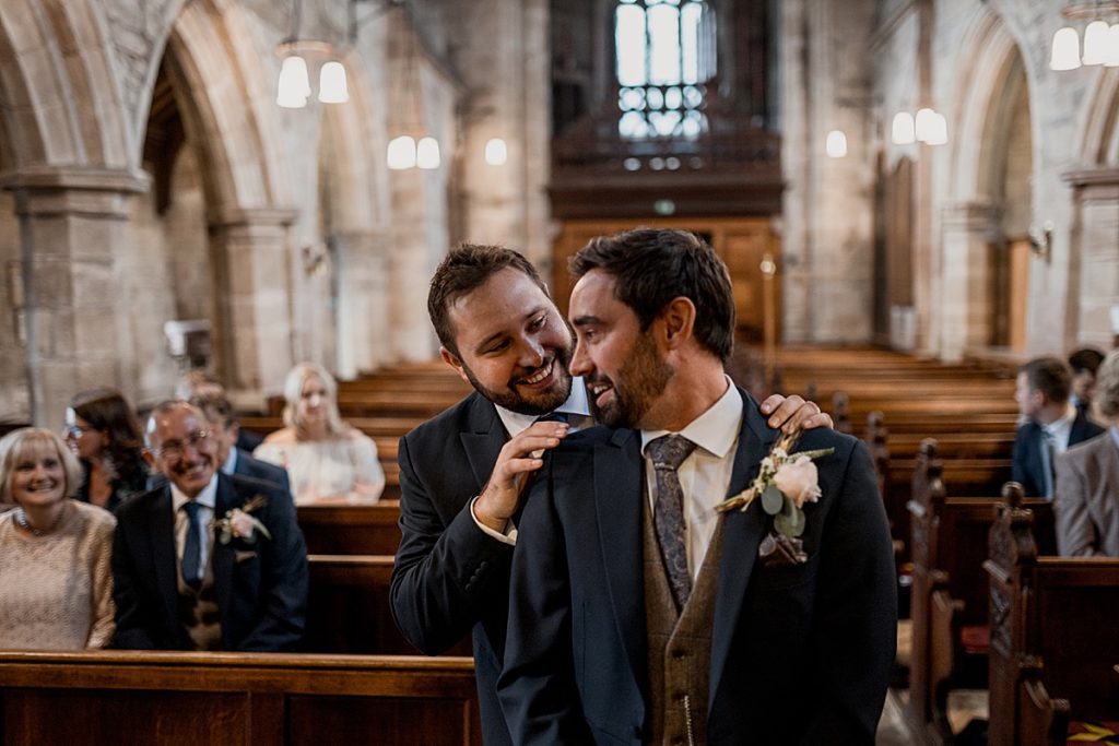groom and best man waiting in church